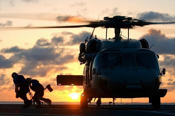 A link to "clip-art" you may find very interesting..take a look!-helicopter_at_sunset_m.jpg